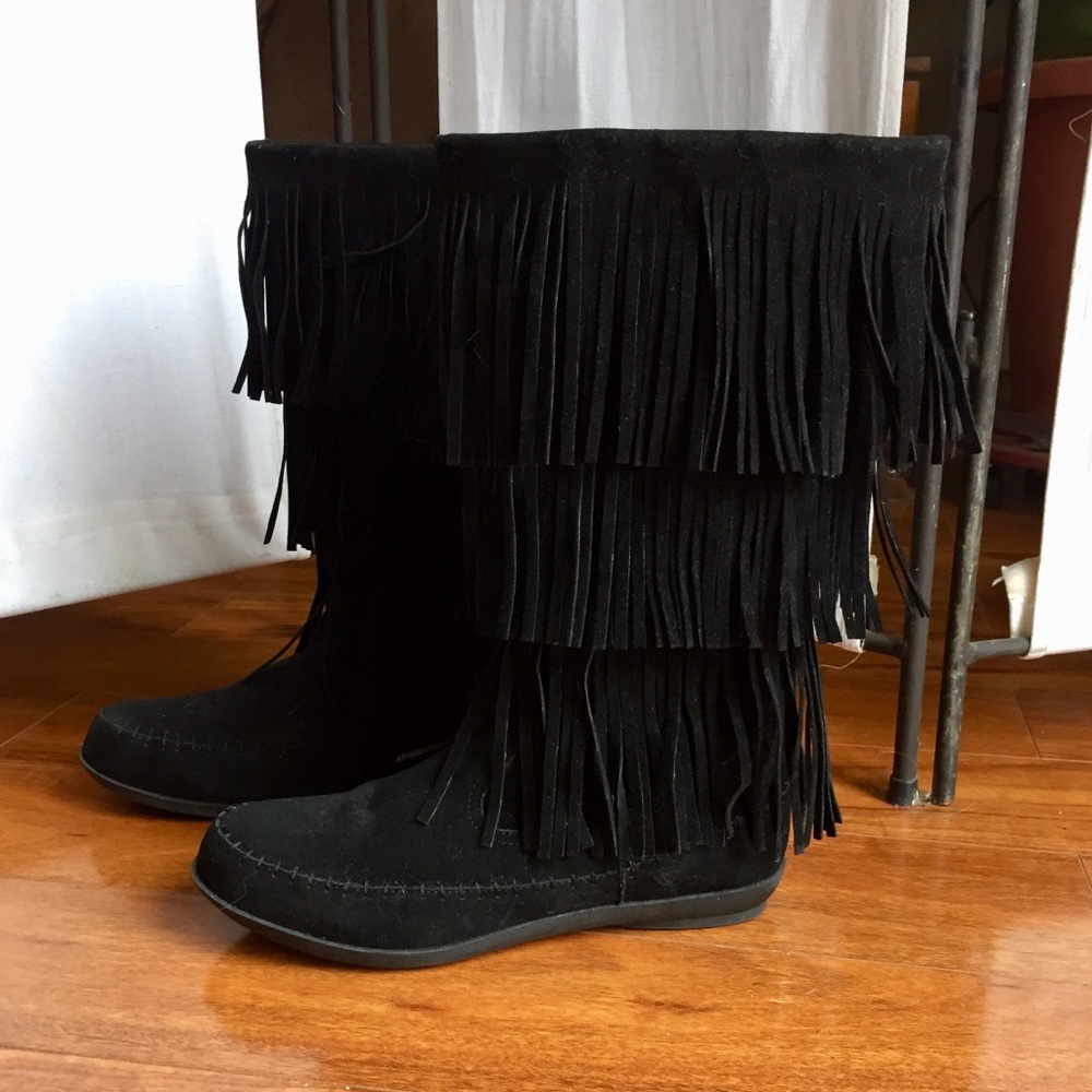 Fringed Minnetonka style boots.